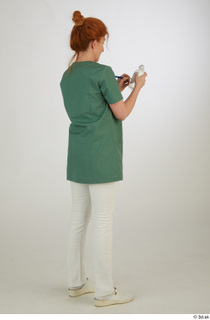  Photos Daya Jones Nurse in green Pose 2 preparing medication standing whole body 0006.jpg